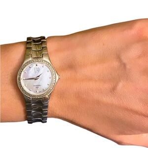 Movado stainless steel watch with natural diamonds & mother of pearl 7 in wrist